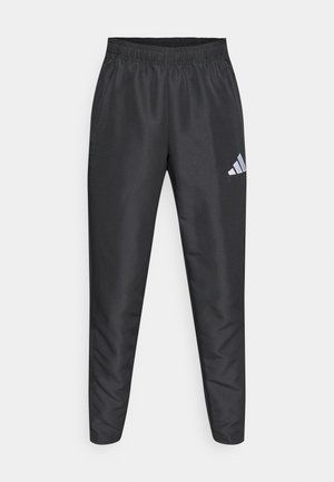 Black athletic pants with an elastic waistband, slim fit, and a white Adidas logo on the left thigh, featuring a smooth, lightweight fabric.