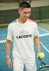 Lacoste Sport T-Shirt sport - white/hydro sierra red