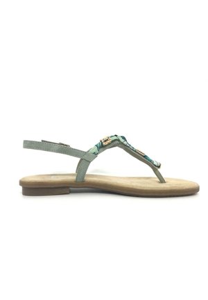 Platte sandaal met beige zool, lichtgroene riemen en decoratieve teal bloemstof op de bovenste riem met kleine gouden accenten.
