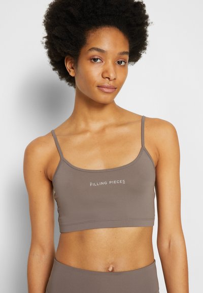 Bralette de algodão castanho com alças finas, decote redondo e logótipo minimalista na frente. Textura suave e lisa com um design ajustado.