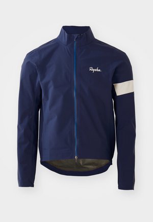 Veste de cyclisme navy fabriquée en matériau léger et r�ésistant à l'eau. Comprend une fermeture éclair frontale, un col haut et des accents réfléchissants gris sur les manches.