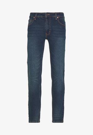 Dunkelblaue Denim-Jeans mit schmaler Passform. Mit fünf Taschen, Kontrastnähten und leichtem Verblassen an den Beinen. Klassischer Knopfverschluss.