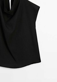 Black short-sleeve top with a draped neckline, smooth texture, and a flowing silhouette. The fabric appears lightweight and slightly matte.