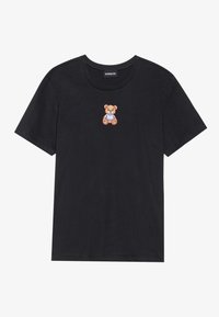 Black cotton t-shirt featuring a small embroidered teddy bear in a blue outfit on the chest. Round neckline and short sleeves.
