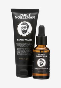 Baardwas in een zwarte tube met witte tekst (75ml) en verzorgende olie in een amberkleurig flesje met een pipet (30ml), voorzien van een label met illustratie.