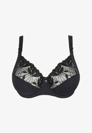 Soutien-gorge noir avec des panneaux en dentelle à motifs floraux, des bonnets moulés, des bretelles réglables et un fermoir décoratif au centre.