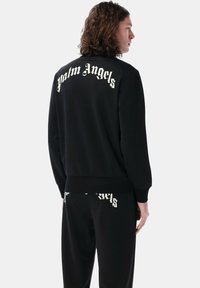 Felpa con zip - black