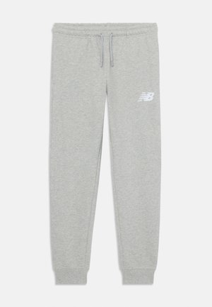 Pantalons de survêtement gris clair en mélange de coton. Dotés d'une taille élastique avec cordon de serrage et d'un logo blanc sur la cuisse gauche. Ourlets aux chevilles.