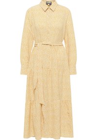 Geel bloemenjurk met een kraag, lange mouwen en een ceintuur in de taille; heeft een gelaagd ontwerp en zachte, lichte stof.