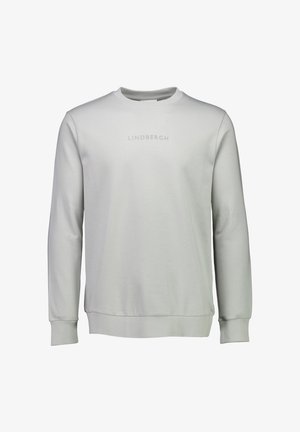 Felpa grigia chiara realizzata in un tessuto morbido. Presenta maniche lunghe, collo rotondo e polsini a coste. Sul davanti è stampato in modo discreto il testo "LINDBERGH".