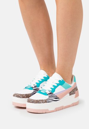 Multicolored sneakers featuring leather and textile materials, with a white base, turquoise accents, and leopard and zebra print details.