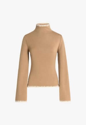 Jersey beige de cuello alto, con mangas acampanadas y un ribete con forma de concha color crema en el escote y el dobladillo. Textura suave.