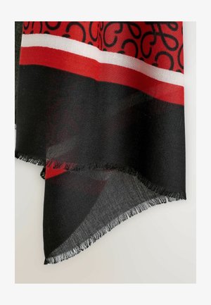Črn šal z drznim rdečim in belim črtastim vzorcem, iz lahkega materiala z resicami na robovih in subtilnim vrtinčastim dizajnom v črni barvi.