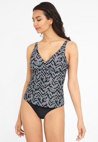 Zwart-wit gestreepte tankini-top met een v-hals, voorzien van een geometrisch ontwerp en geplooide details in het midden, gecombineerd met een zwarte zwembodem.
