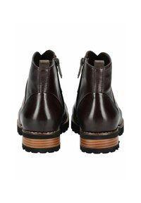 Botas de tobillo de cuero marrón con un acabado suave, cremalleras traseras y un tacón de madera apilada con una suela de goma negra.