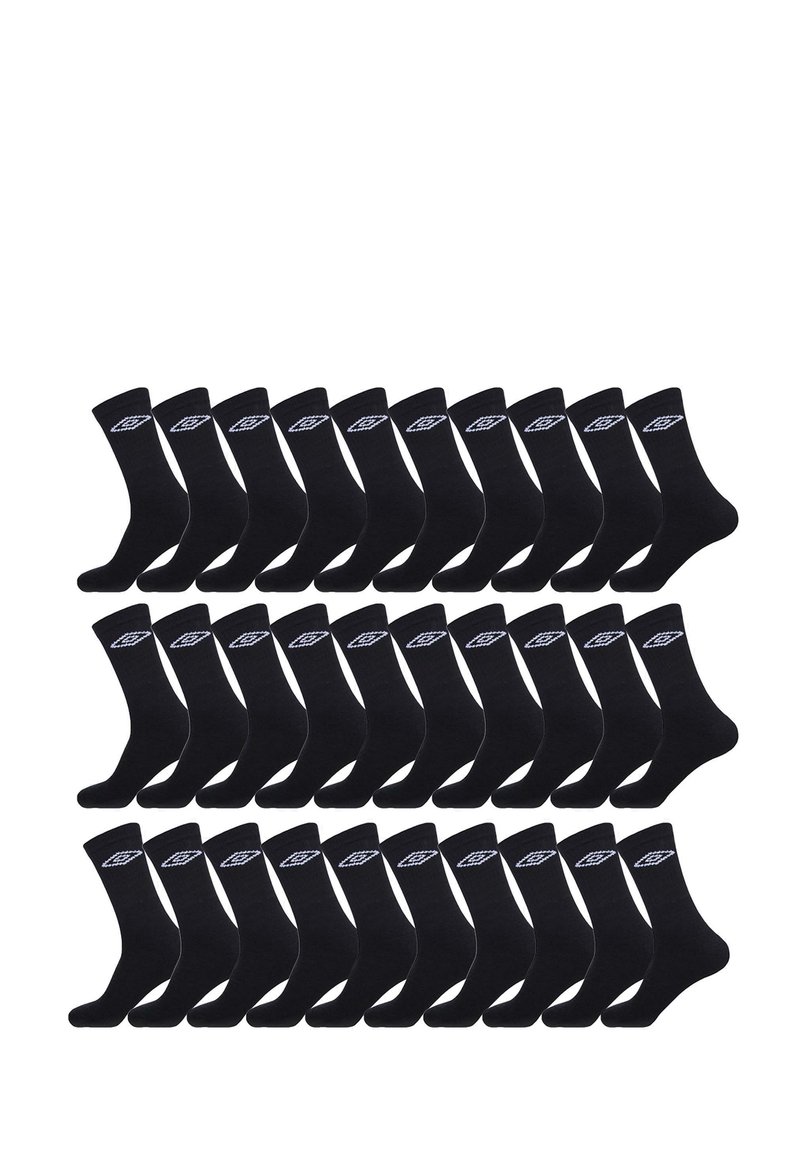 Chaussettes en coton noir disposées en grille, avec un logo blanc sur le revers. Texture douce et design mi-mollet.