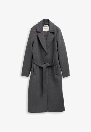 Pikk tumehall villane mantel laia krae, kahe esipainutusega nupu ja küljetaskutega, millel on samasugune vöö, mis on seotud vöökohtade ümber.