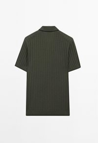 Ribbed short-sleeve polo shirt in dark green with a collar and straight hem. Features a fine texture and no visible logos or accents.