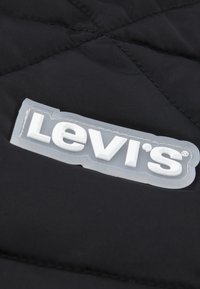 Levi's® A LINE PUFFER UNISEX - Vinterjacka - black