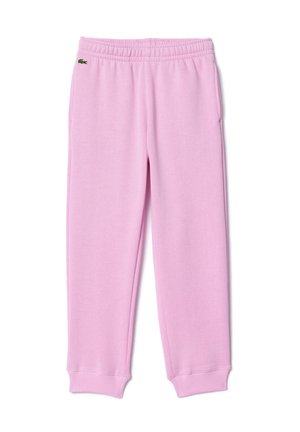 Pantalons de survêtement en coton rose avec une taille élastique, des poignets côtelés, des poches latérales et un petit logo vert sur la cuisse gauche.