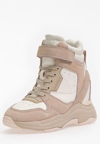Tan and cream high-top sneakers with suede and leather materials. Features include laces, a Velcro strap, and textured rubber sole.