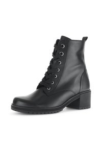 Bottines en cuir noir avec un bout rond, un laçage à l'avant, des œillets en métal et un talon carré. Semelle texturée pour une meilleure adhérence.