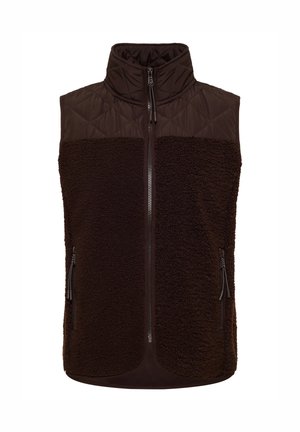 Bruine vest met een doorgestikte bovenkant en een fuzzy onderkant. Voorzien van hoge kraag, volledige ritssluiting aan de voorkant en twee ritszakken aan de zijkant.