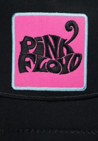 Black fabric cap featuring a pink and blue embroidered patch with the text "PINK FLOYD" in a stylized black font.