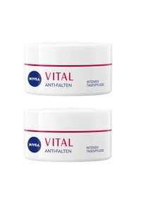NIVEA Vital Anti-Falten cream jars; round, white plastic containers with blue logo, pink stripe, and bold text. Two jars stacked.