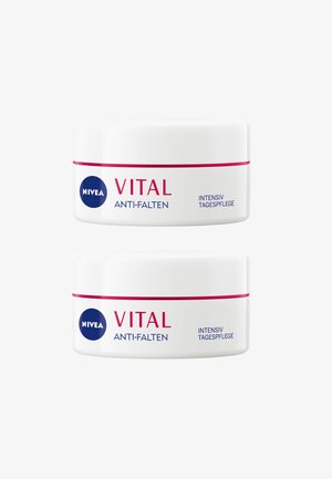 NIVEA Vital Anti-Falten cream jars; round, white plastic containers with blue logo, pink stripe, and bold text. Two jars stacked.