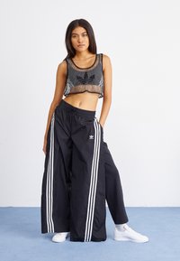 adidas Originals Tracksuit bottoms - black