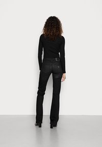 Guess SEXY BOOT - Calças de ganga bootcut - planet luxe