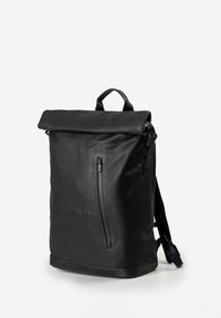 Black roll-top backpack with front vertical zipper pocket, padded shoulder straps, and top carrying handle, displayed on a light background.