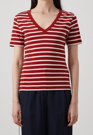 Red and cream striped short-sleeve V-neck shirt made of soft fabric, featuring a small logo detail on the left chest and a fitted design.