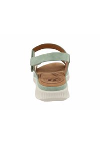 Mint green suede sandal with a soft, light-colored footbed and adjustable strap. Features a textured, white rubber sole and minimal design.