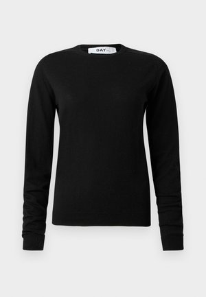 Suéter negro de manga larga hecho de un material suave, con cuello redondo y puños y dobladillo acanalados. Diseño minimalista sin patrones.