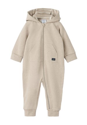 Beige hættetrøjedragt med lynlås foran, lange ærmer, to sidelommer og en stribet indvendig foring. Blød stoftekstur, afslappet pasform.