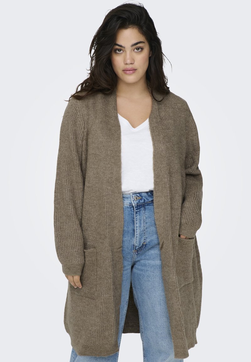 Lång, stickad cardigan i brunt, med V-ringning, öppen front och två sidofickor. Strukturerad tyg och avslappnad passform. Avslappnad look.