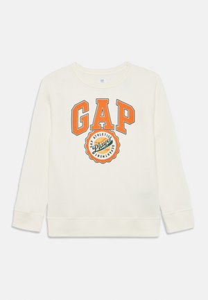 Cream-colored sweatshirt with long sleeves, featuring a large orange "GAP" print and a circular logo in green and orange.
