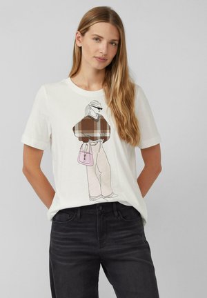 White cotton t-shirt featuring a graphic of a figure in a brown plaid sweater and light-colored pants, holding a pink handbag.