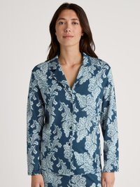 Långärmad pyjamasöverdel i teal med vit paisleymönster, med notched krage och knäppning framtill. Mjuk och slät textur.