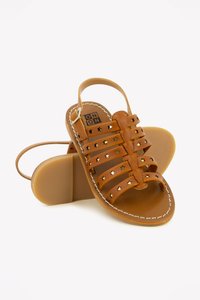 Brown leather sandals featuring multiple horizontal straps with gold star cutouts, a back strap, and a flat sole with a textured pattern.
