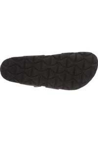 Černá guma podešve boty s texturovaným vzorem na podrážce, který obsahuje diamantové tvary pro lepší trakci. Vyztužené okraje zajišťují odolnost.