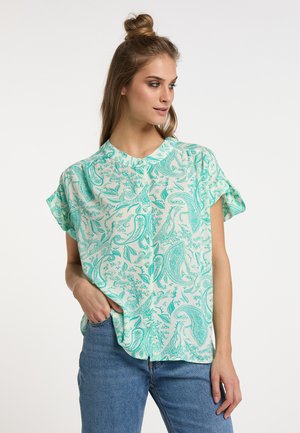 Blusa mint verde a maniche corte con motivo paisley, realizzata in tessuto leggero, con una vestibilità morbida e orlo arrotondato.