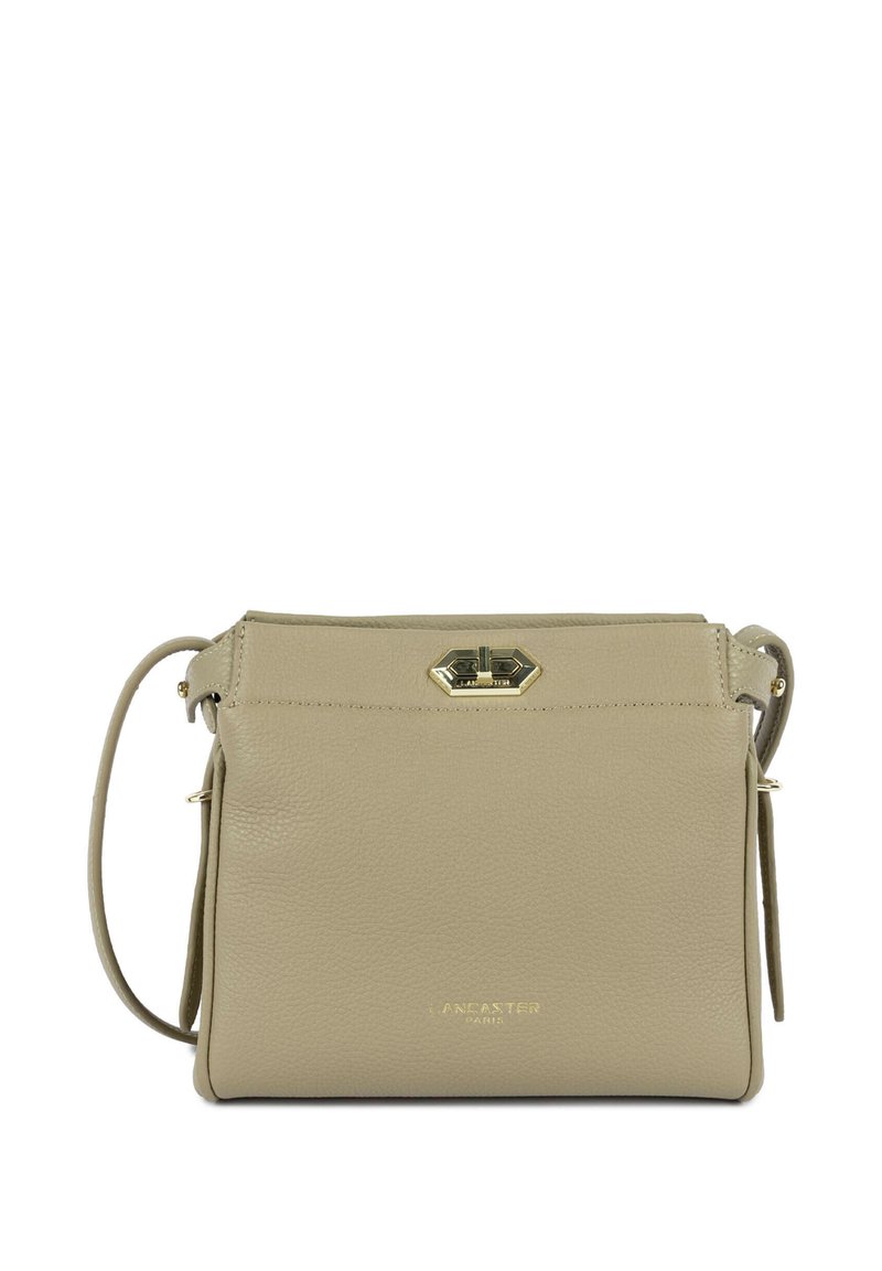 Light beige leather crossbody bag with a textured surface, gold-tone hardware, and a logo on the front. Features an adjustable strap.