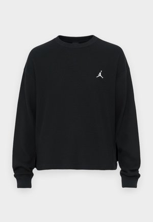 Schwarzer, langärmliger Sweatshirt aus strukturiertem Stoff. Verfügt über einen runden Halsausschnitt und ein kleines weißes Jordan-Logo auf der Brust.