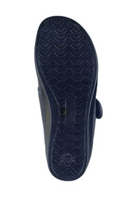 Navy blue slipper sole with textured rubber for grip, featuring a contoured shape and a logo imprint, enhancing traction and comfort.