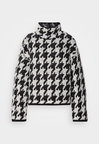 Black and white houndstooth patterned turtleneck sweater, textured knit fabric, relaxed fit, cropped length, and long sleeves.