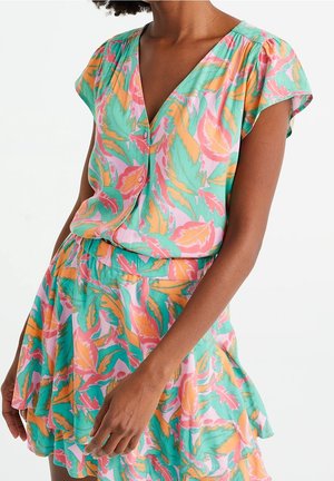 Short-sleeve dress with a V-neck, featuring a colorful leaf pattern in pink, orange, and green. Lightweight, flowing fabric with a flared hem.