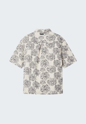 Short-sleeve cream shirt with black abstract floral patterns, single pleat below the yoke, and a folded collar.